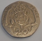 Les pièces de monnaie originales sont une tradition britannique (ici une ancienne pièce de 20 pence)